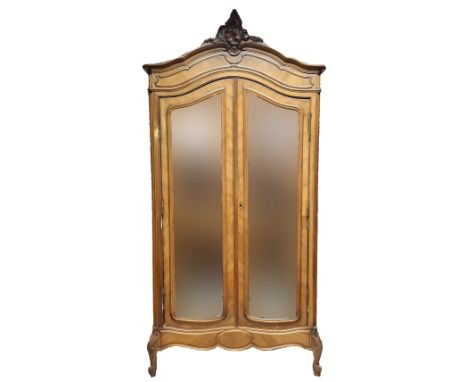 A French 19th century Louis XV style kingwood mirror front armoire wardrobe. The wardrobe having a&nbsp; carved foliate embel