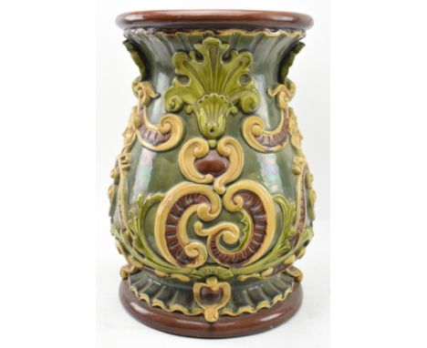 A Doulton Lambeth majolica glazed ceramic garden seat. The stand having a trefoil shaped hole to top over a baluster shaped b