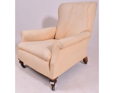 In the manner of Howard &amp; Sons - A Victorian 19th century oak &amp; upholstered armchair. The armchair upholstered in Cal