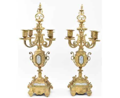 A pair of French Louis XVI style 19th century gilt metal &amp; ceramic desk table candelabras. Each having a central scrolled