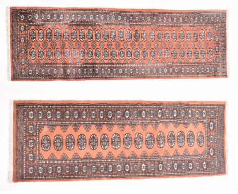 A near pair of 20th century&nbsp;Persian style machine woven woollen carpet rug runners. One large than the other with each h