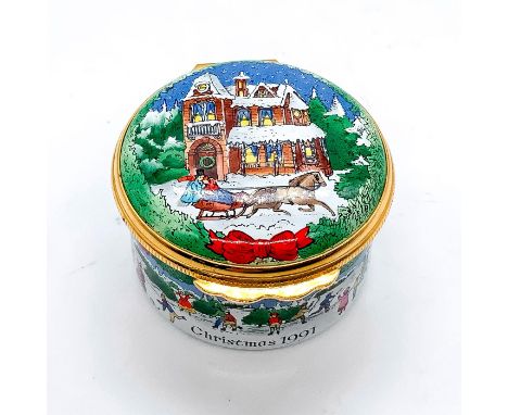 Decorated with festive winter scenes of couple on a sleigh ride and people ice skating and enjoying the outdoors. Hinged lid 