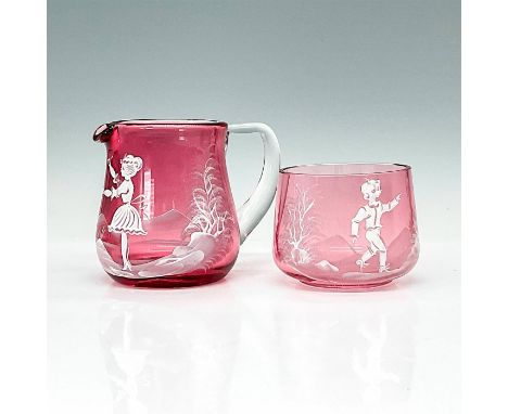 Ruby colored glass with clear handle depicts boy and girl playing in a nature scene. Larger piece with measurements 4.5"L x 3