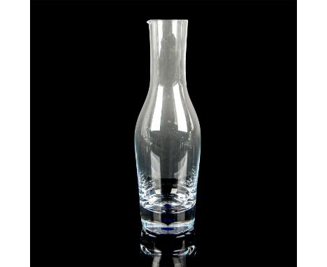 Clear glass beverage carafe with cobalt blue accent within the base. Orrefors Sweden etched mark. Issued: 20th c.Dimensions: 