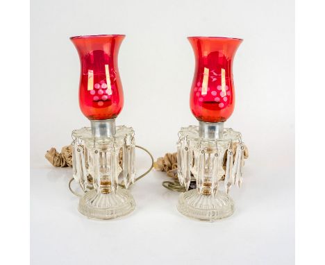 Pair of mid-century style pressed glass lamp bases with cranberry colored glass shades with frosted details and glass pendant