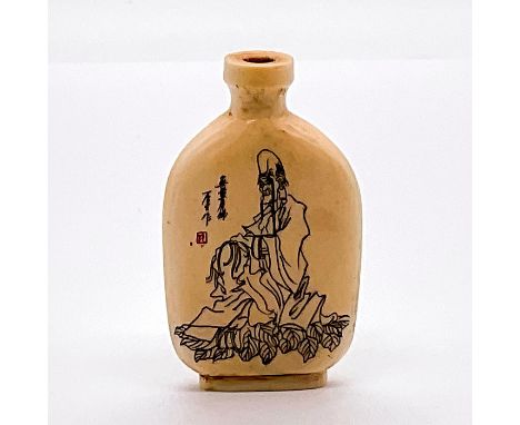 A vessel with an etching of Nan-ji-xian-weng, the God of Longevity, on one side. A carved relief of an elder man reading a bo