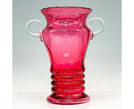 Hand blown ruby red glass with dot optic in body with hand pulled applied clear glass handles. Issued: early 20th CenturyDime