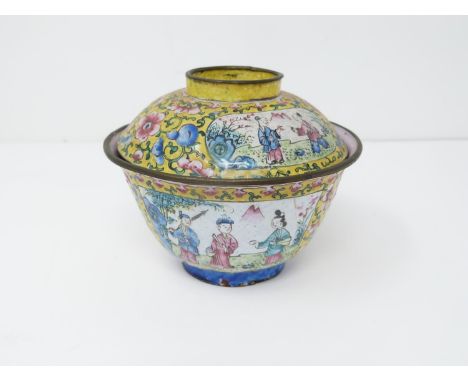 A late Qing Canton enamel lidded tea bowl. Decorated with Chinese figures and flowers on an imperial yellow ground, pale pink