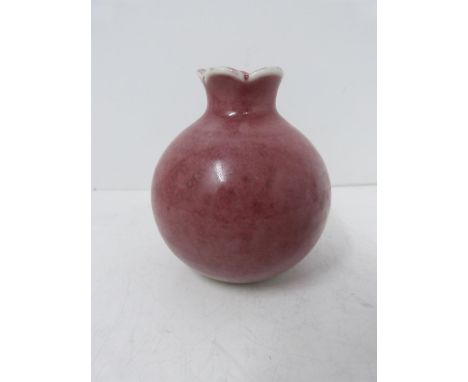 A Kangxi style pomegranate form water pot with 'peachbloom' glaze, six-character mark to base. Height 9.5cm. 