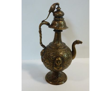 A 19th century Indian repousse design brass samovar. The finial of the hinged lid in the form of a parakeet and the spout in 