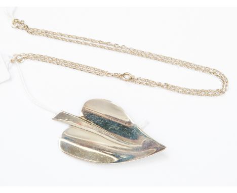 A white metal brooch with a modernist style arrow shaped leaf; together with a silver chain (2) 