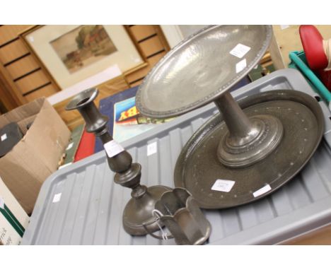 A pewter 'Tudric' comport, with similar pewter planished plate and mug, also including a candlestick (4) 
