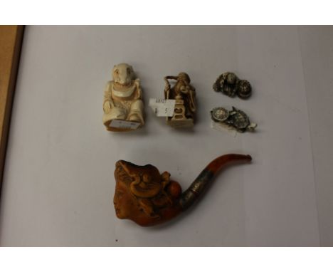 Four Japanese Netsukes, one of two turtles on a leaf plus three others, together with a Meerschaum pipe of a female bust, wit