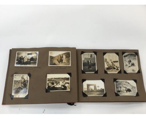 An album of 1930s photographs, predominantly travel throughout UK and Europe, some published tourist cards, together with an 