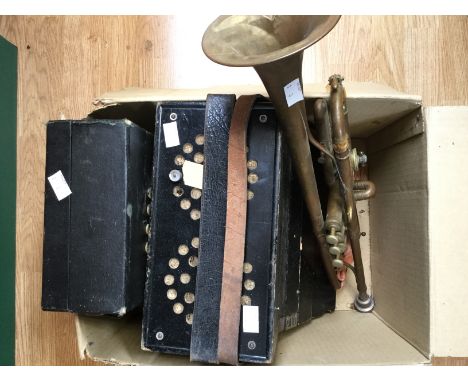 A clarinet in box and an accordion and a brass trumpet 