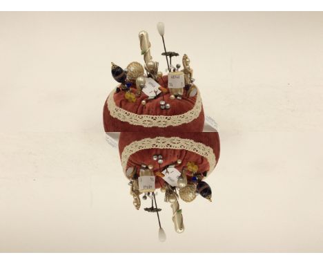 Hat pin cushion with a collection of 20th century hat pins