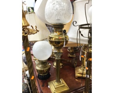 A brass single burner oil lamp, Corinthian Column base, original acid etched glass shade funnel  