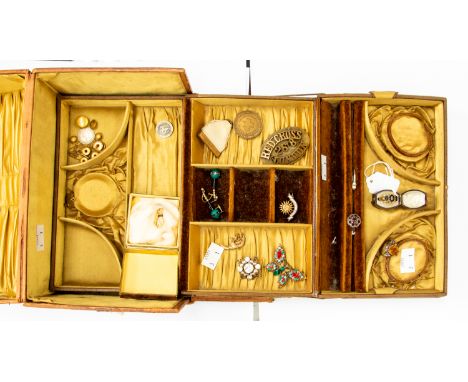 An Art Nouveau embossed leather jewellery case, silk lined, including an unmarked yellow metal, probably 15ct gold and black 