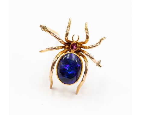 A black opal and ruby brooch, in the form of a spider, the body set with a black oval  opal measuring approximately 13mm x 12