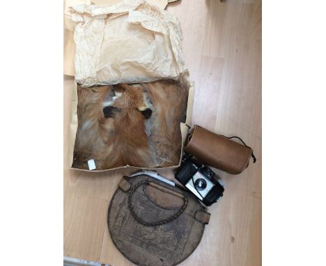 A 1920s Egyptian leather hand bag with handkerchief , a fox fur shoulder stole (Bergen), a Knitting neckband,  and a Brownie 