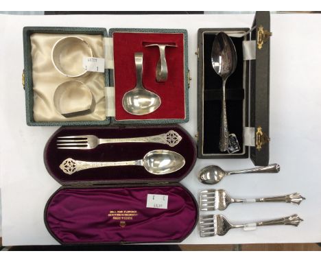 A collection of silver ware to include boxed Christening spoon and fork, boxed spoon and pushers and two napkin rings of diff