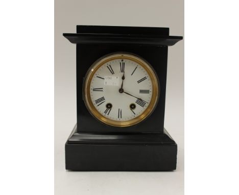 A Victorian black slate eight day mantle clock, having an white enamelled dial, with Roman numerals