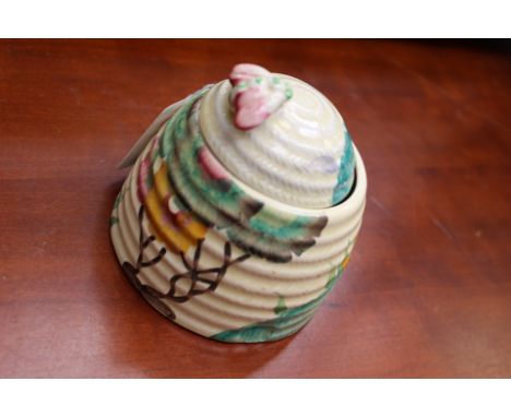 Clarice Cliff for Wilkinson, a Rhodanthe beehive honey pot, Bizarre mark, 9cm high