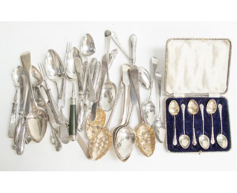 A collection of George III and later silver flatware including berry spoons, tablespoons, teaspoons, etc, fiddle and Old Engl