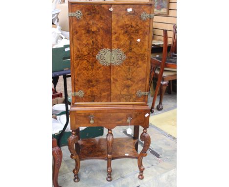 A Burrwood walnut quarter veneered smoking cabinet with drawer, raised on carved cabriole legs with shelf, together with Chin