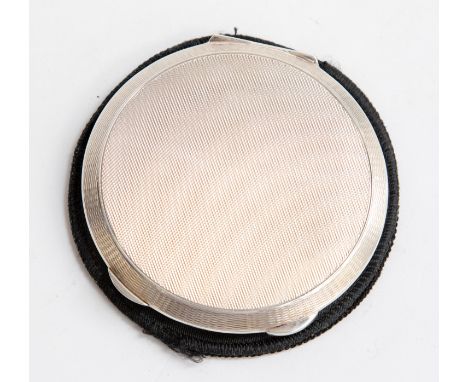 Garrard and Co, a silver compact, circular form, engine turned, Birmingham 1961, 3.78 ozt approx, with silk pouch