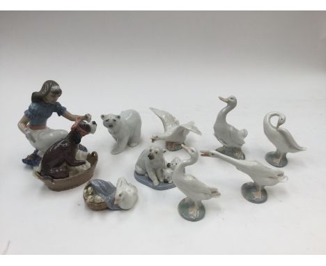 A Lladro figural group 'Take Your Medicine', No 5921 together with figures of geesea duck and ducklings, polar bear and polar