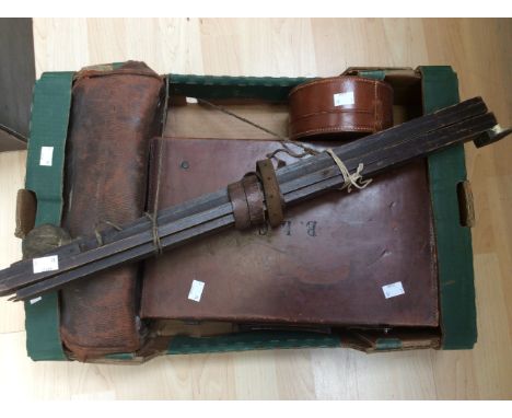 A collection of artists companion, including two leather cases, various watercolour paints, crayons, buffer, camera etc