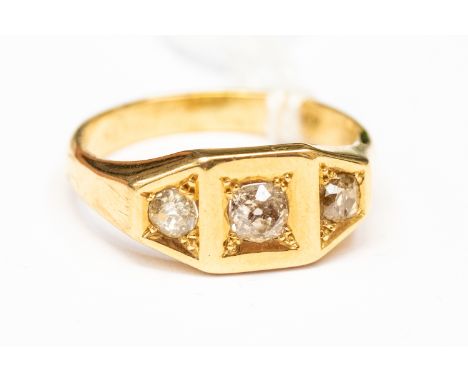 A diamond and 18ct gold three stone ring, square setting to the centre, claw set with an old cut diamond, with a further two 