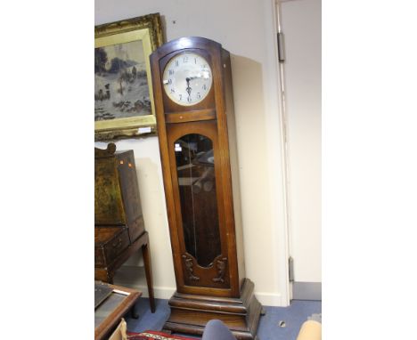 A George V Tymo oak cased longcase clock, circa 1920, having a seven / eight day triple weighted movement, complete with thre