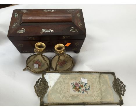 A 19th Century inlaid rosewood sarcophagus shaped tea caddy (damages) together with dressing table ware, including gilt metal