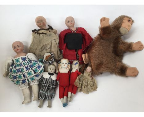 A collection of porcelain head dolls, some marked D.P.C., possibly Diamond Pottery Company, together with two Japanese porcel