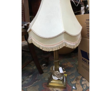 A brass Corinthian column lamp base and shade 