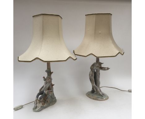 Two Lladro table lamps 'Harlequin', playing violin by tree trunk, and seated boy with his dog by tree trunk, both with lamp s