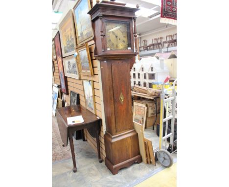 A George III oak longcase clock, having a single winder hole, brass dial, single weight and pendulum