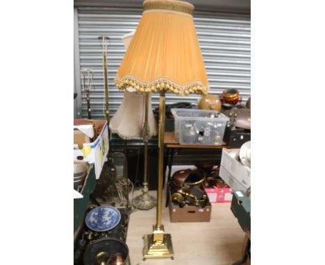 A brass floor standing lamp base