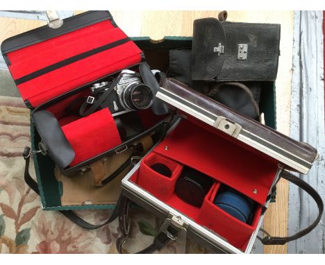An early Kodak cine 8 film camera in original case, a Nikkormat SLR and lenses and a Nikon SLR EM camera and lenses 