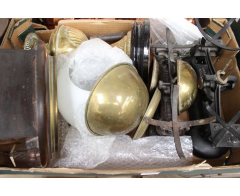 A set of brass/cast scales and another similar set of weights, a cast iron, a small school room type clock and an oil lamp (o
