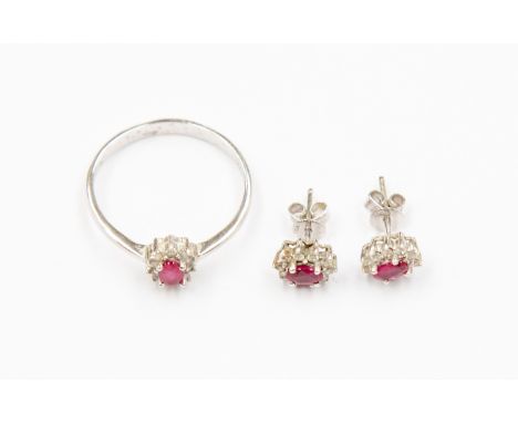 An 18ct white gold ruby and diamond duet ring and earring set 