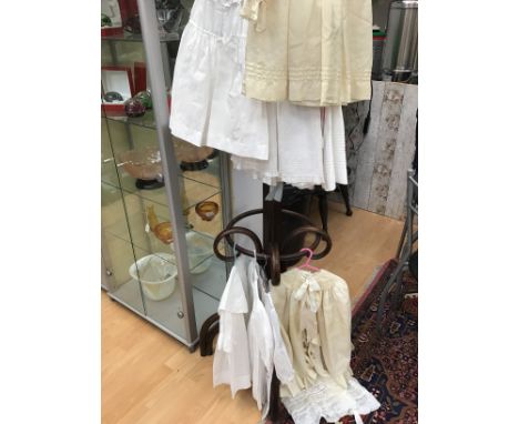 A cream silk christening (Edwardian) cape with a satin tie and lace collar, together with a cream silk christening gown, a ch