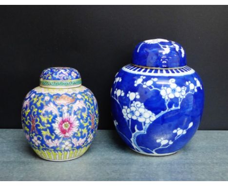 Chinese ginger jars to include a blue and white prunus patterned jar, together with a canton enamel floral patterned jar and 
