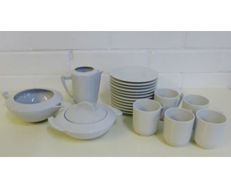 A quantity of Limoges white glazed tea wares to include cups, saucers, milk jug and sugar bowl