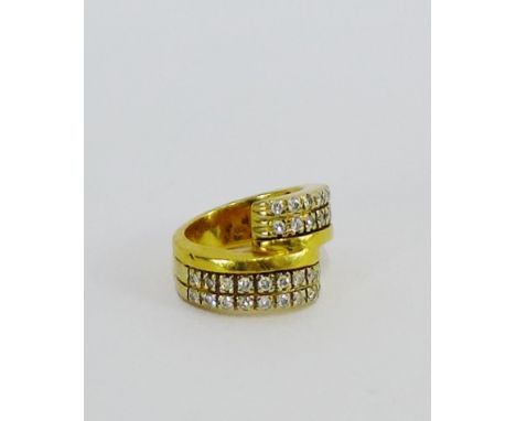 A diamond set dress ring on a yellow metal band UK ring size K