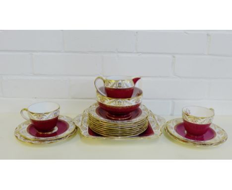 A Spode 'Regent' patterned twelve piece teaset, comprising twelve cups, twelve saucers, twelve side plates, sugar bowl, milk 