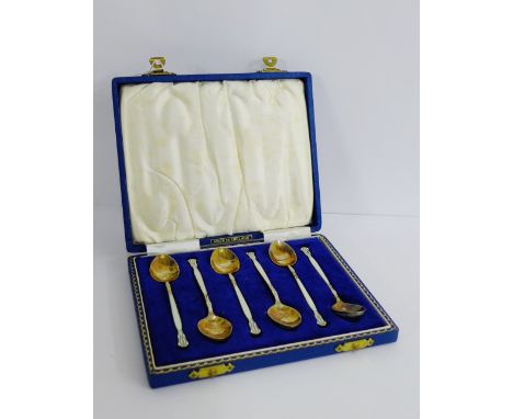 A set of six Birmingham silver gilt and guilloche enamel teaspoons, each bowl with a different spray of flowers, in fitted ca