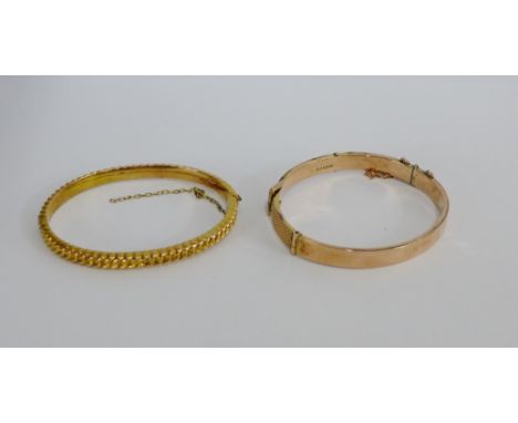 9 carat rose gold buckle bangle together with a 9 carat gold rope twist effect bangle (2) 